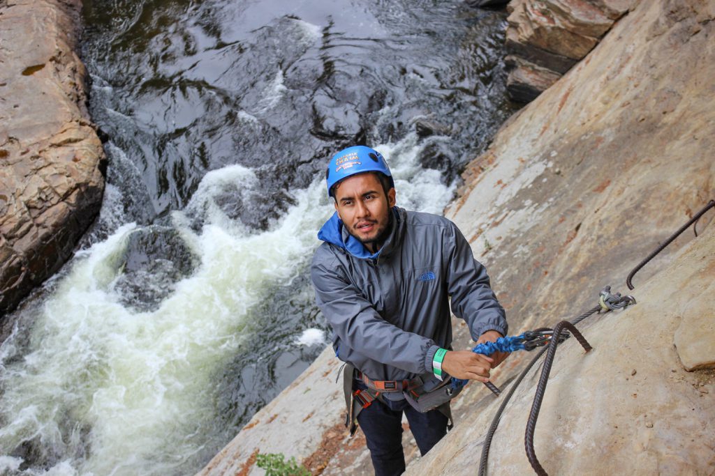 Luis Yanes rock climbs at Ausable Chasm