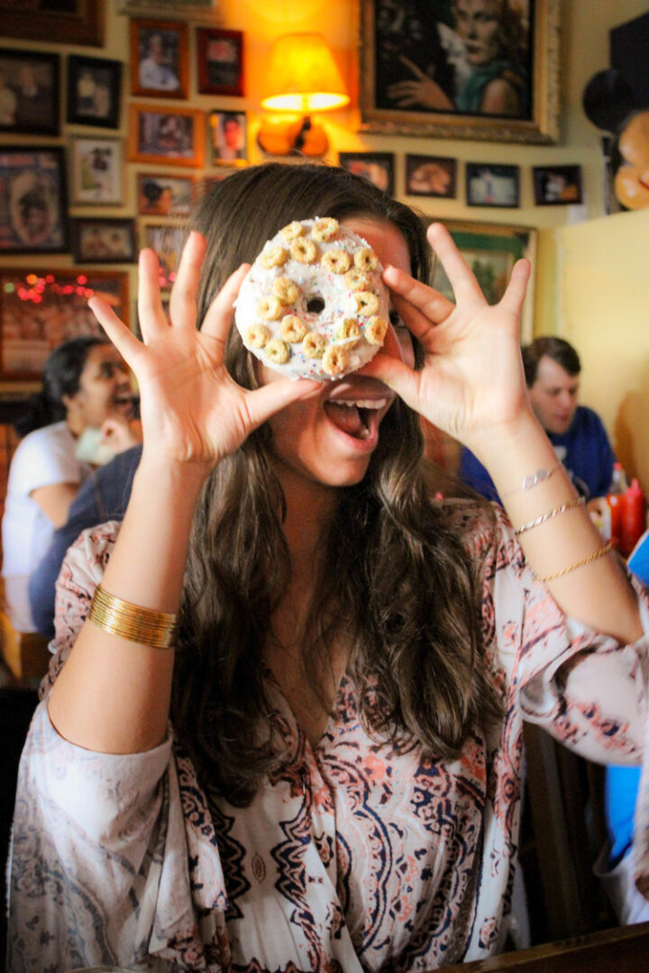 Zehra having fun with the  Cap'n crunch cake doughnut