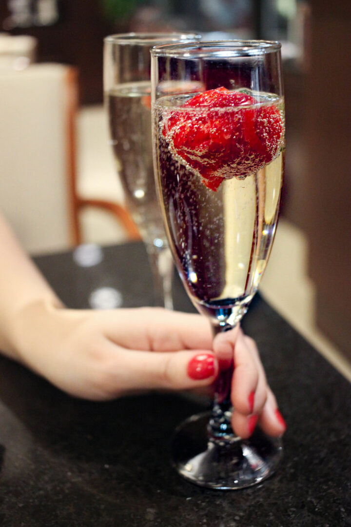A glass of Prosecco with strawberry