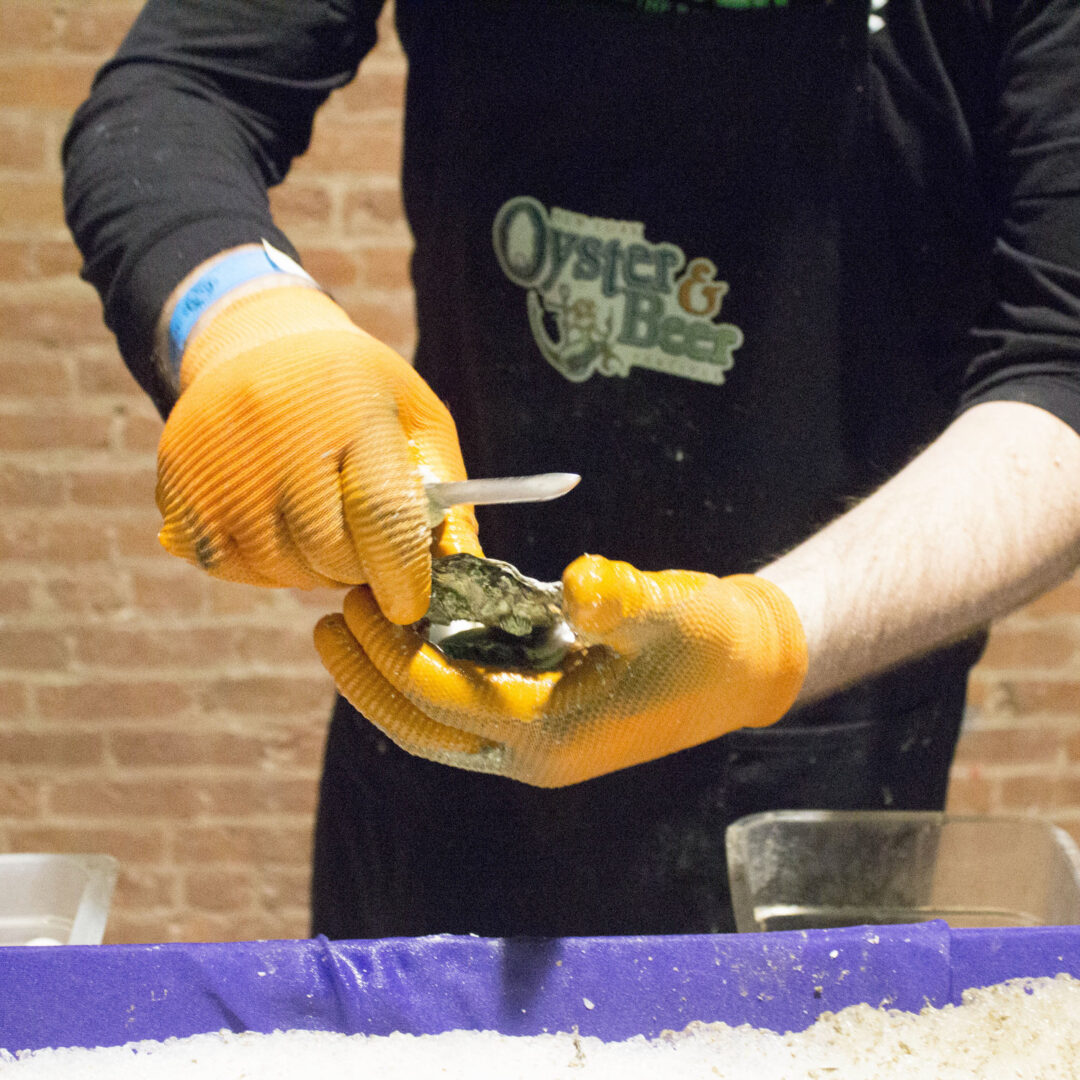 A oyster is shucked, ready to eat. 