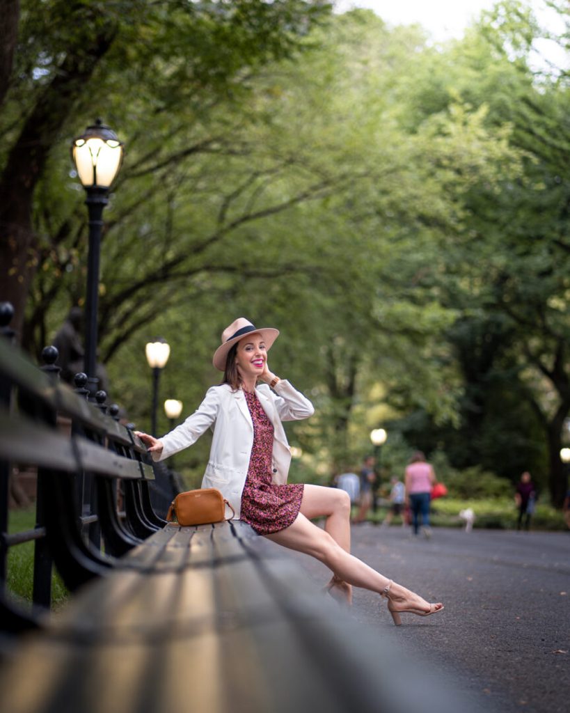 Sitting on a bench at The Mall in Central Park. 