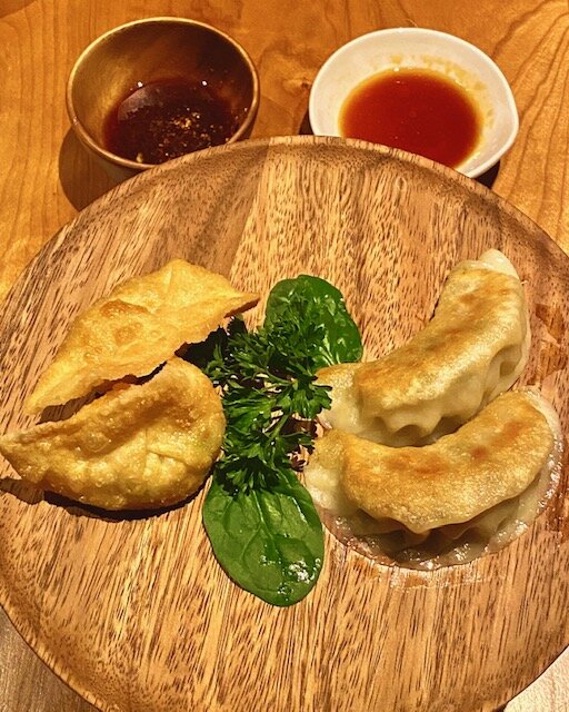 Prawn & Edamame Crispy Gyoza  (left)  Signature   Sanpoutei Pork Gyoza  (right).  Photo by: Stefanie DiMartino