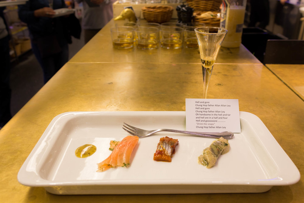 Salmon with mustard sauce, two different pickled herrings, and Linie liquor at Hav