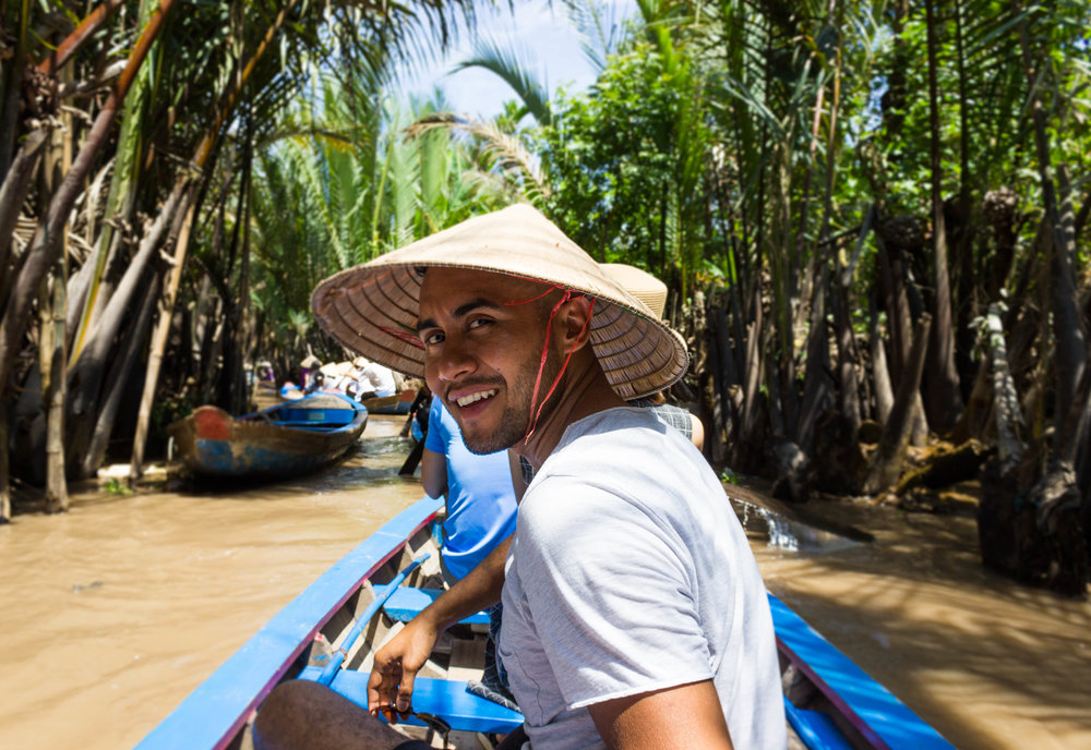 Riding on small boats in the Mekong River delta