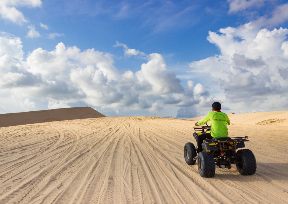 Riding on ATV's in the white sand dunes of Mui Ne