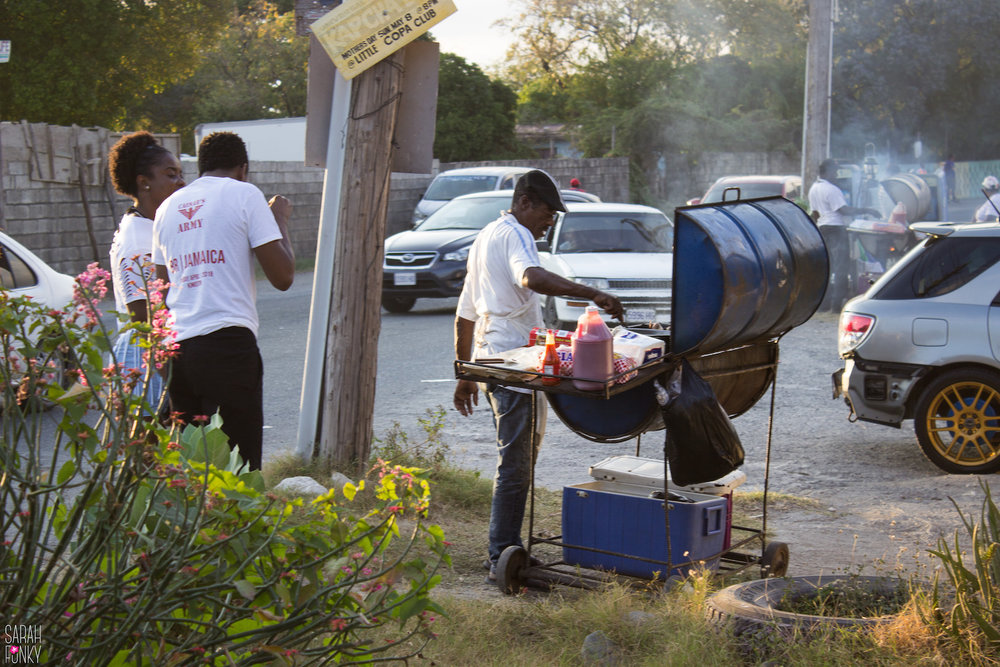 Jamaican's cooking outside of a party