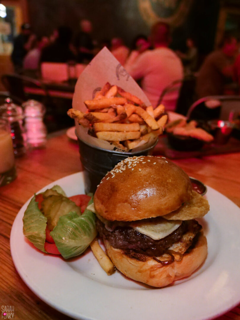 A burger at the Highwest Distillery and Salon